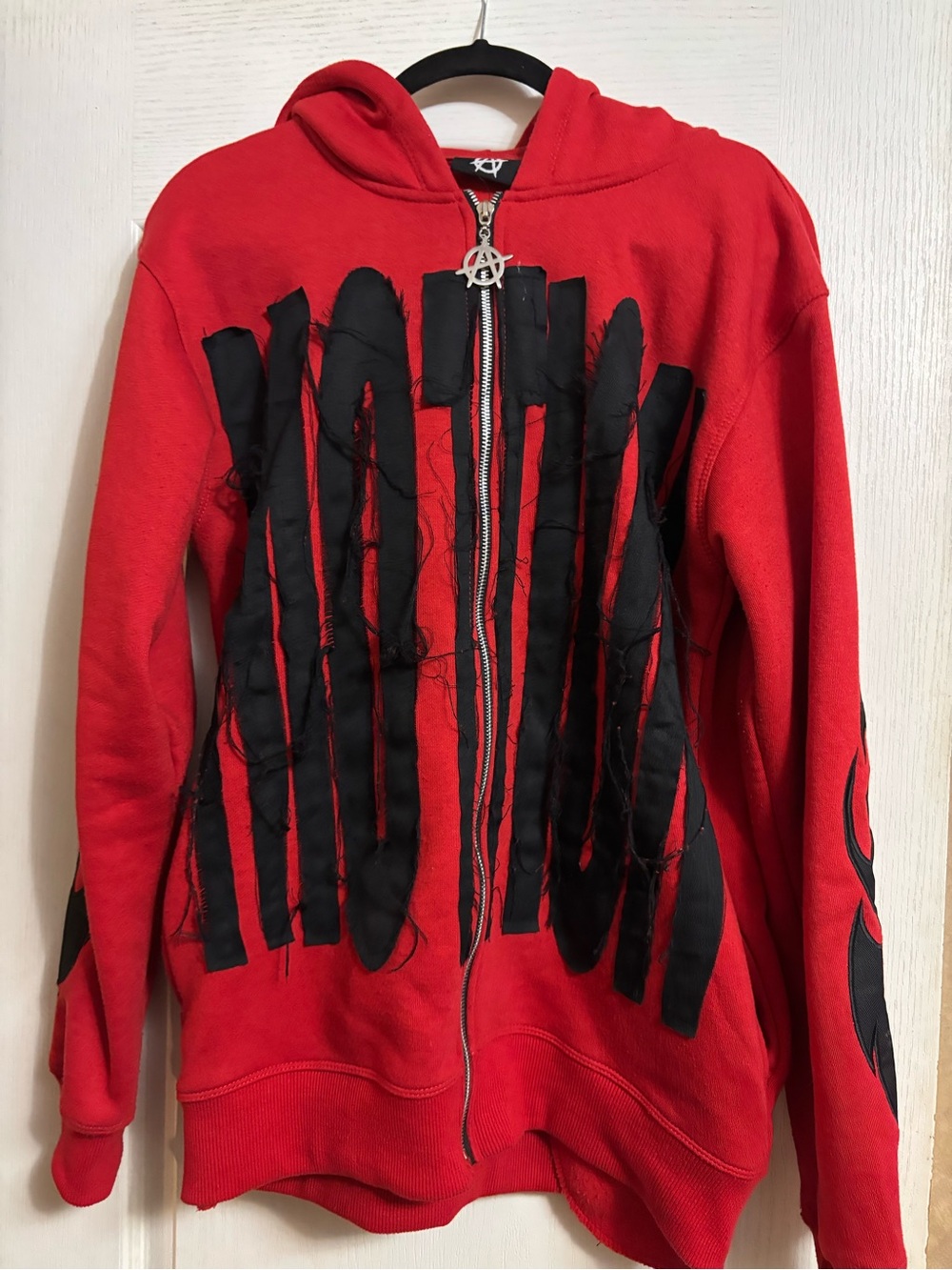 Red Zip-Up Hoodie with Distressed Black Appliqué